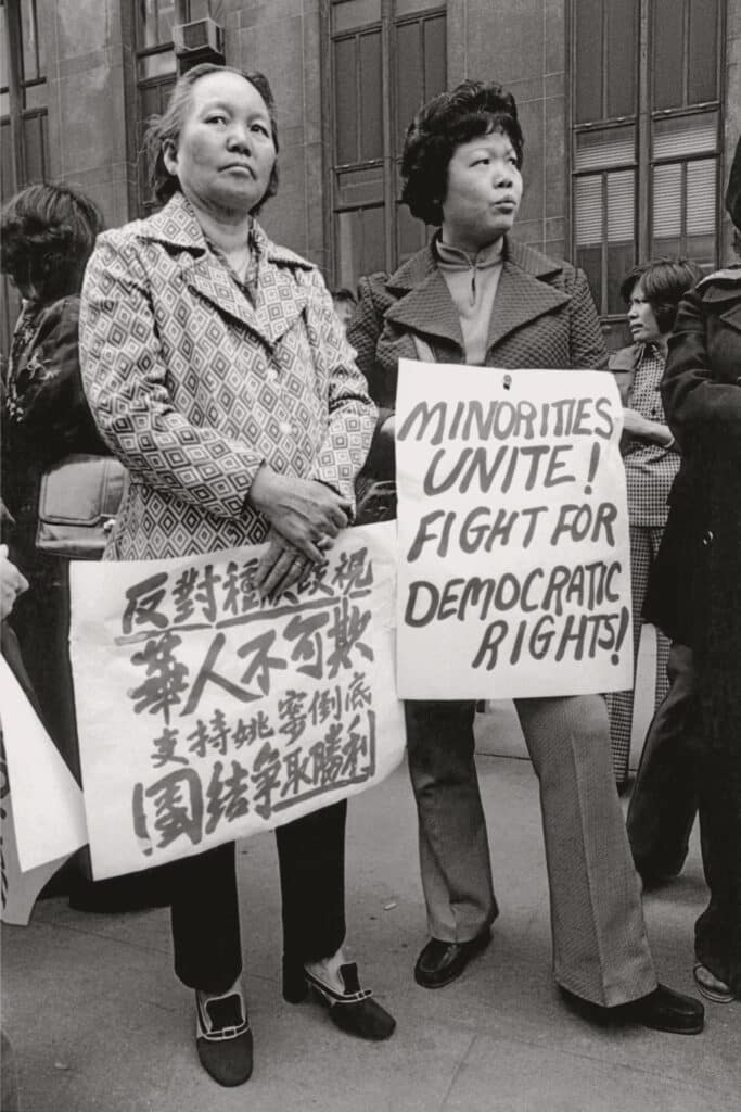 The sign in Chinese reads: “Down with racist oppression/ Justice for Peter Yew now/Unite and fight to victory.” New York, 1975 © 2024 by the Estate of Corky Lee