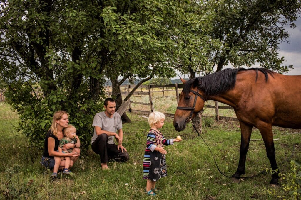 Living in the Middle of Conflict, Donbass, 2018. © Anastasia Taylor-Lind / Imperial War Museums. (photo of the family with the horse)