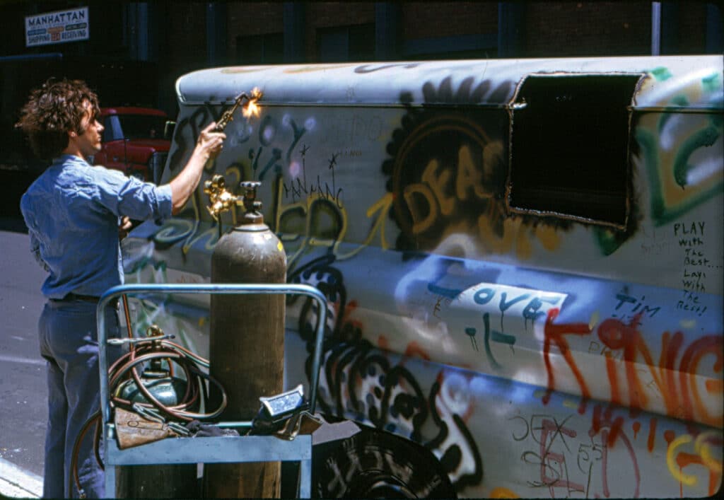 Godon Matta Clark. Gordon Matta-Clark cutting Graffiti Truck at “Alternatives” to Washington Square Art Show, June 1973. © The Estate of Gordon Matta-Clark/Artists Rights Society (ARS), New York. Courtesy The Estate of Gordon Matta-Clark and David Zwirner.