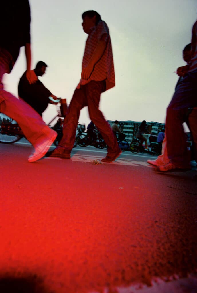 Mo Yi (英救). From the series Red Streets, 2003. Courtesy of the artist / UCCA Center for Contemporary Art.