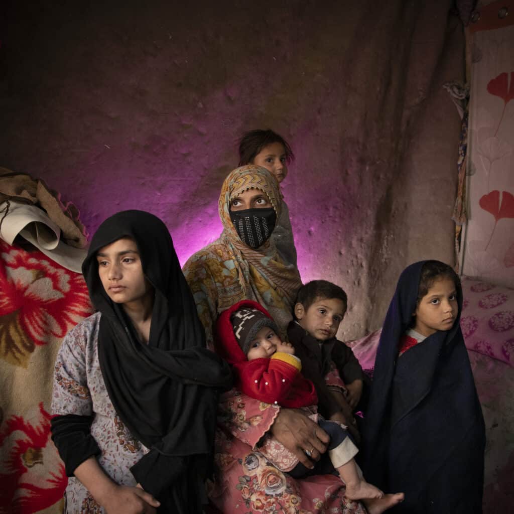 Jalal Abad, Nangarhar, Afghanistan, February 12, 2024. A family, recently deported out of Pakistan has temporarily settled in suburban neighbourhood of Jalal Abad in eastern Afghanistan. Hundreds of thousands of Afghans have been forced out of Pakistan following the ongoing crackdown on illegal foreigners, some of which after decades of living in Pakistan. Women and girls are the most affected by the consequences of forced displacement, with for example high rates of child marriage. © Kiana Hayeri for Fondation Carmignac