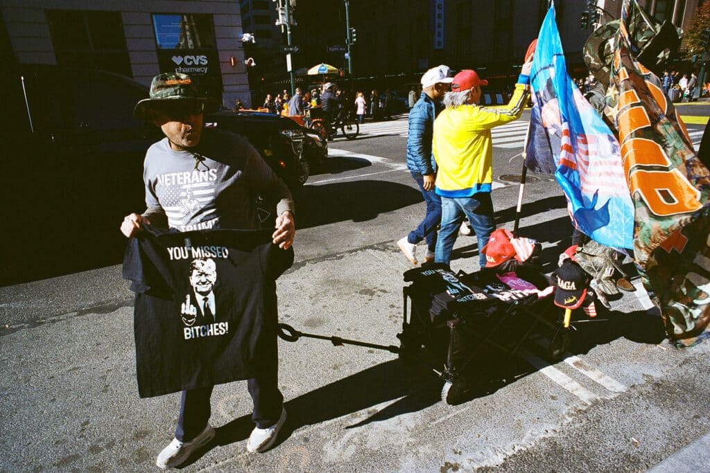 Pro-Trump Merchandise Seller at the Donald Trump Rally at Madison Square Garden. New York City. October 27, 2024 © Robert E. Gerhardt