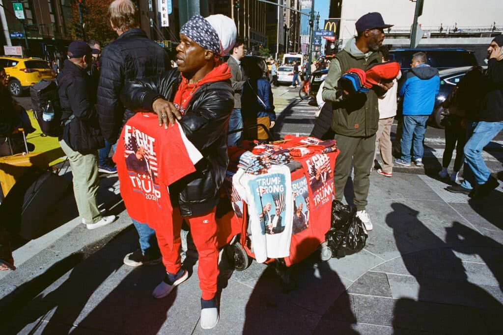 Pro-Trump Merchandise Seller at the Donald Trump Rally at Madison Square Garden. New York City. October 27, 2024 © Robert E. Gerhardt