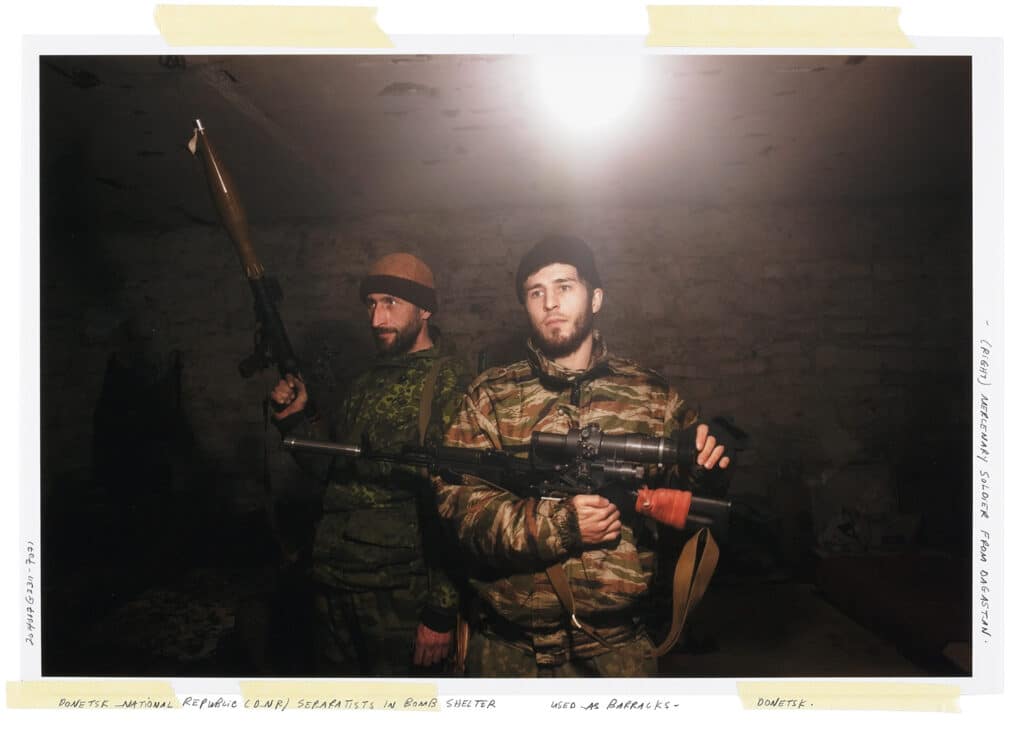 Muslim mercenary from Dagastan (middle) with Donbass separatist. Petrovskyi neighborhood, Donetsk. November 23, 2014 © Larry Towell / Magnum Photos