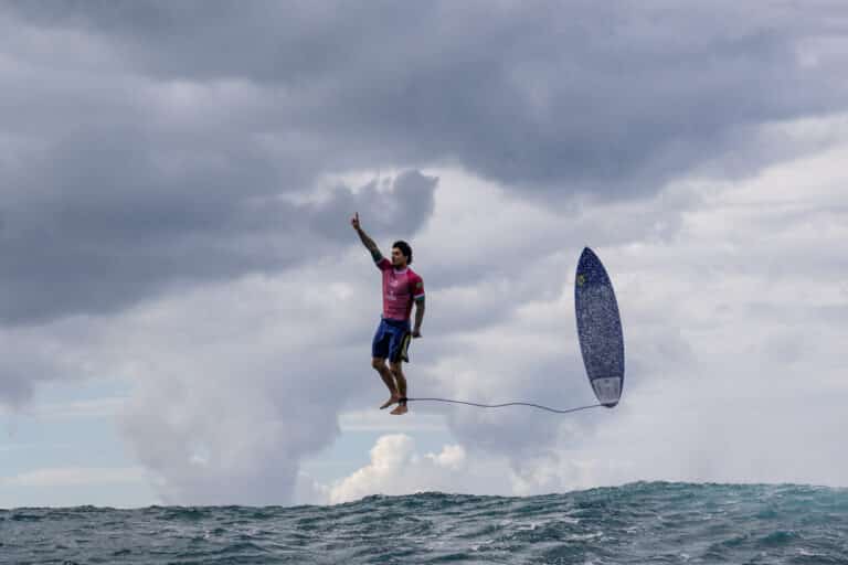 Gabriel Medina thanking God with this celebration and getting the best score of the surfing Olympics history. The alignment of Gabriel’s relaxed body with his surfboard, connected by the leash, his feet on a cloud, makes this photo unreal and inevitably attracts the eye of the observer. - Golden Moment © Jérôme Brouillet