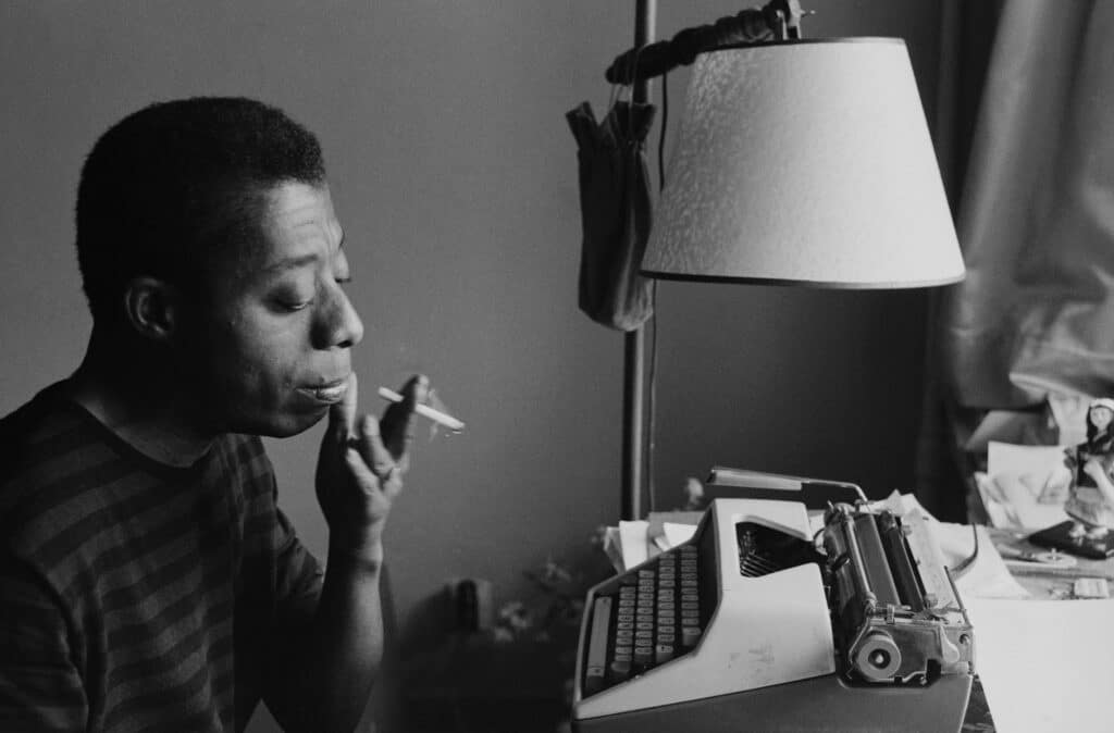 Baldwin working on his novel, Tell Me How Long the Train’s Been Gone, 1965. © Sedat Pakay