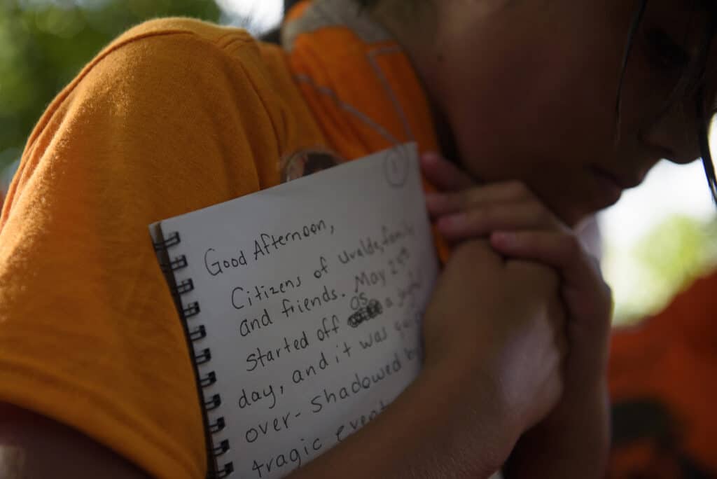 July 10th, 2022. Uvalde, Texas. Caitlyne Gonzales, who survived a mass shooting at Robb Elementary School that left 19 children and two adults dead, clutches a speech she plans to deliver as community members and activists gather for The Unheard Voices March and Rally. © Callaghan O’Hare for The New York Times