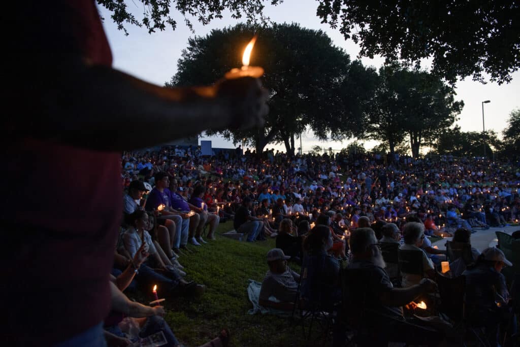 May 24th, 2023. Uvalde, Texas. Community members gather for a vigil to mark the one-year anniversary of a mass shooting at Robb Elementary School, which left 19 children and two adults dead. © Callaghan O’Hare for The New York Times